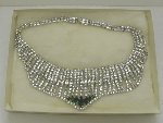 Bib Style Rhinestone Necklace with Seven Centered Emerald Colored Stones